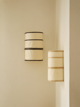 Applique en bambou de couleur naturelle et noire à accrocher au mur