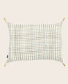 Housse de coussin en coton blanche avec des carreaux et des pompons