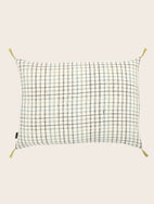 Housse de coussin en coton blanche avec des carreaux et des pompons