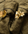 Ronds de serviette Floria en métal doré fleur et feuille