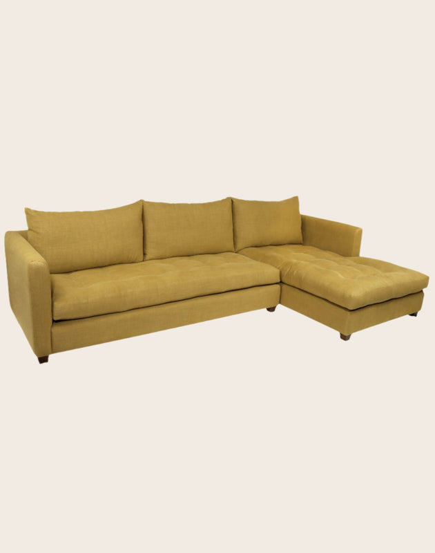 Grand canapé d'angle capitonné