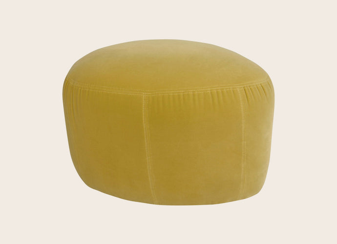 Petit pouf rond en tissu pour un salon Caillou
